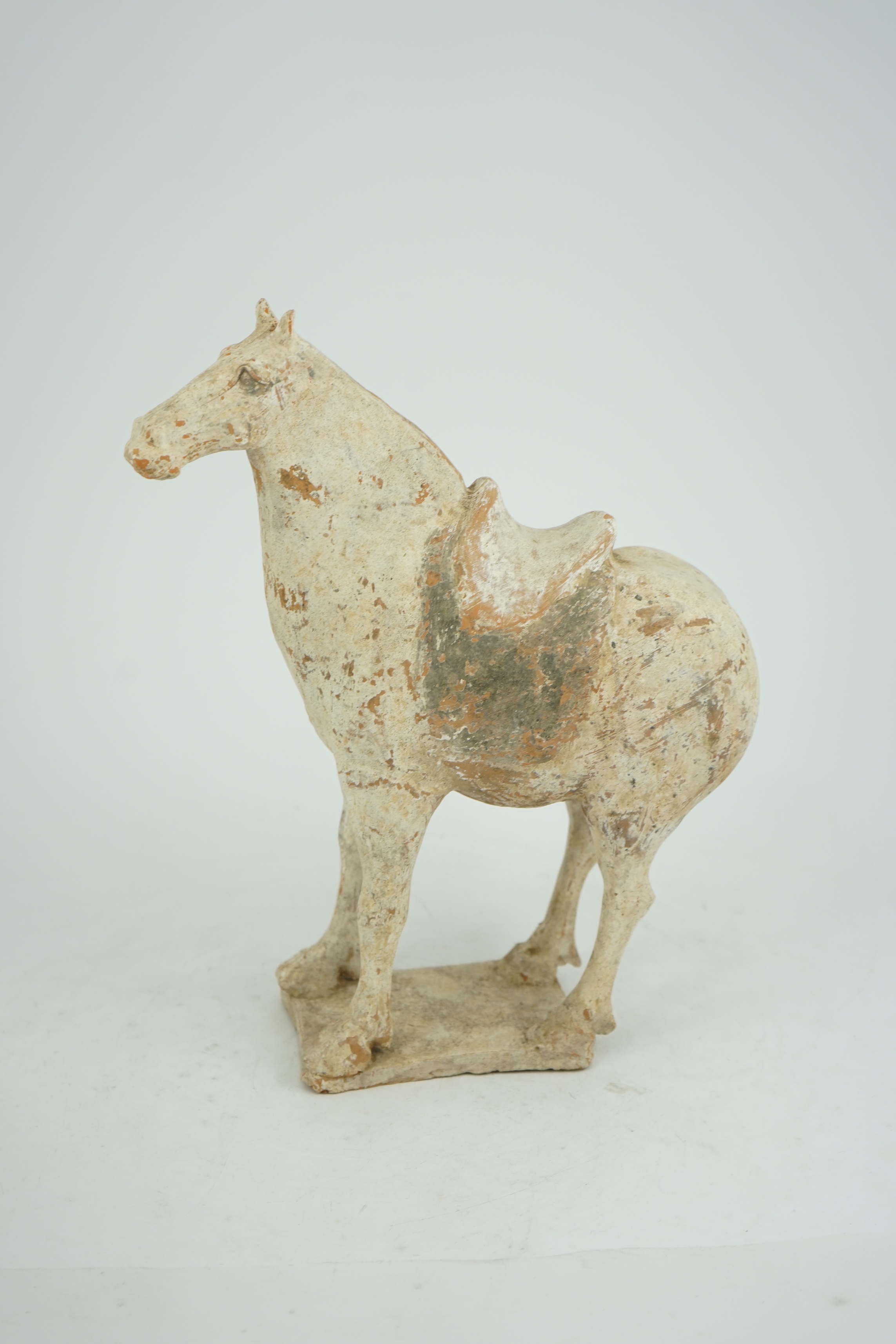 A Chinese painted pottery saddled horse, Tang Dynasty (AD 618-906)